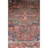 A Caucasian rug, the central medallion in terracotta, cinnamon, cream, pale gold and blue,