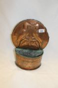 A Newlyn School copper wall pocket with arched spiked top,