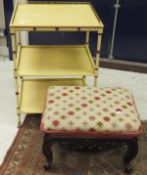 A rosewood framed needlework topped footstool, raised on carved cabriole legs to scroll feet,