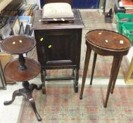 A 19th Century mahogany kettle stand raised on square tapering legs to spade feet,