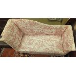 A chaise longue upholstered in white and pale red patterned fabric CONDITION REPORTS