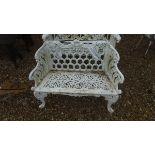 A painted cast iron bench in the Edwardian taste with scrolling decoration CONDITION