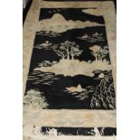 A Chinese Superwash rug, the central panel depicting a lake scene within floral decorated borders,