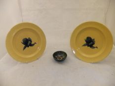 A pair of Moorcroft yellow ground Iris plates and a small pin dish