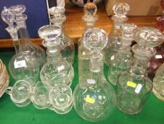 A collection of decanters and other glassware to include various 19th Century ring-necked decanters,