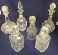 A collection of 19th Century and later cut glass and other decanters,