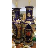 A pair of mid 20th Century Chinese blue glazed gilt and enamel decorated floor vases,