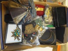 A box of assorted costume jewellery and a tin of buttons together with a box of assorted coin sets,