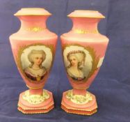 A pair of 19th Century Sevres vases with salmon pink ground and circular medallions,