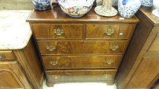 A 19th Century mahogany chest of two short and three long drawers with brass handles and