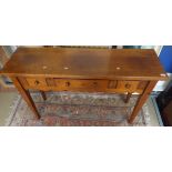 A Chalon fruitwood side table, the plain top above three drawers to a shaped apron,