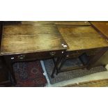 An 19th Century oak single drawer side table on turned legs to pad feet,