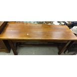 A large hardwood serving table, the plain top above two drawers,