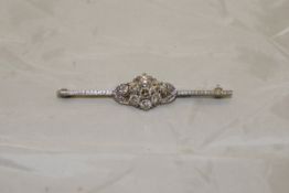 A white gold mounted diamond cluster brooch of flowerhead and foliate design, 6.