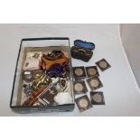A box containing a collection of costume jewellery, a silver lidded dressing table jar,