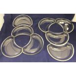 A set of eight crescent shaped glass dishes by Val St.