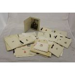 A collection of vintage Christmas cards, many relating to World War II and military subjects,