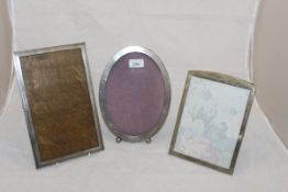 An oval sterling silver photograph frame,