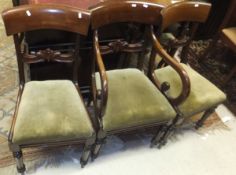 A set of four mahogany bar back dining chairs with turned front legs (3 + 1 carver)