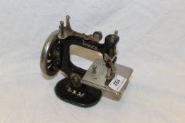 A Victorian miniature Singer sewing machine