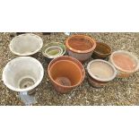 Ten assorted garden plant pots to include a pair with brown floral glazed finish