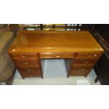 A modern Chinese hardwood pedestal desk, the plain top above a row of three drawers,