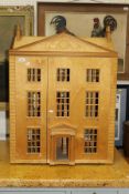 A plywood three-storey doll's house (un-painted)