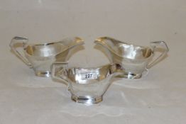 A pair of silver sauceboats (by Fattorini & Sons, Birmingham, 1939 and 1940),