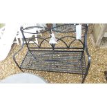 A black painted metal two seat bench,