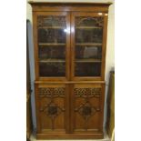 A Victorian Gothic Revival oak bookcase cabinet,