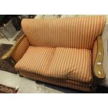 An early 20th Century two seat sofa with barley-twist oak show frame,