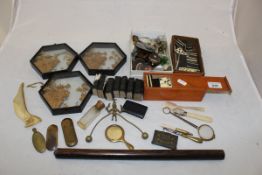 A box of miscellaneous decorative items to include a miniature tortoiseshell and mother of pearl