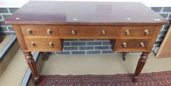 A Victorian mahogany dressing table/writing desk with five drawers with brass handles,