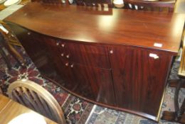 A circa 2002 Skovby (Danish) Santos rosewood dining suite comprising elliptical rectangular dining