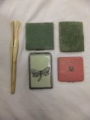 A box containing a 19th Century pierced fan, a plastic fan, a green shagreen covered cigarette case,