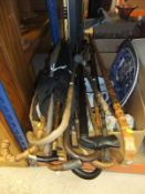 A large collection of walking sticks and umbrellas, to include metal mounted examples,