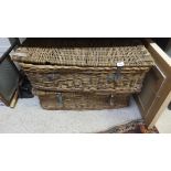 A pair of wicker and hide bound linen hampers