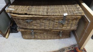 A pair of wicker and hide bound linen hampers