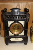 A circa 1900 ebonised cased mantel clock with polychrome tile decoration in the Aesthetic taste,