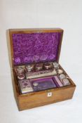 A Victorian walnut cased lady's travelling vanity box with various fittings,