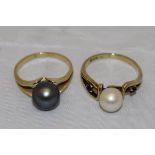 An 18ct gold black pearl (dyed) solitare dress ring, the pearl approx 8mm diameter, size N ,