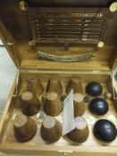 A teak cased set of Barlow and Tyrie English Garden traditional skittles and accessories