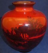 A Doulton flambé vase decorated with rural scene of riverside cottage by Charles Noake,