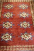 A Persian rug with eight central diamond-shaped medallions in cream, green,