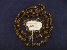 A tiger's eye necklace and similar bracelet,