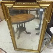 A gilt framed wall mirror