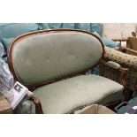 A mahogany framed serpentine fronted two seater sofa with green diamond patterned upholstered seat,