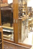 An Edwardian mahogany and inlaid double mirror door wardrobe with two drawers,