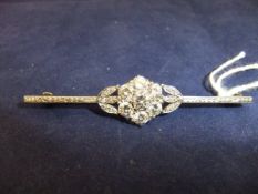 A white gold mounted diamond cluster brooch of flowerhead and foliate design, 6.