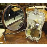 A 19th Century oval toilet mirror and a gilt decorated mirror on stand